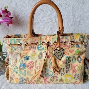 EUC Dooney & Bourke Signature Tassel Top Handle Hand Bag Ivory / Tan